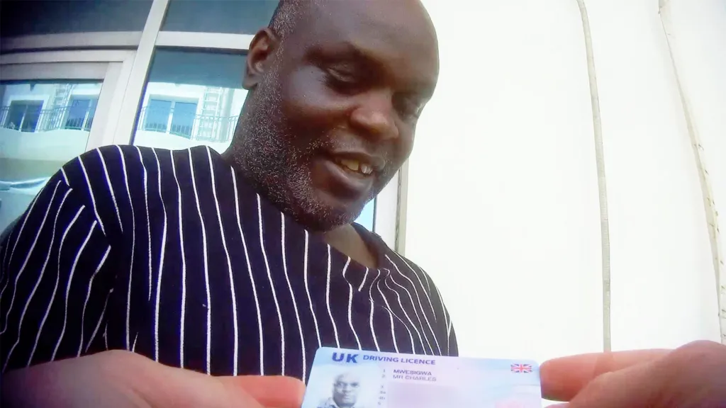 Mr Mwesigwa showed us his UK driving licence and said he was a former London bus driver