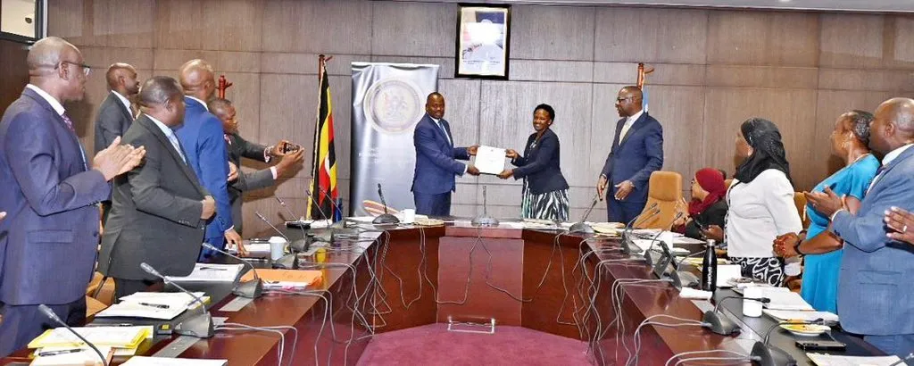 Hon. Haruna Kasolo officially hands over the foreign affairs ministry to Amb. Adonia Ayebare