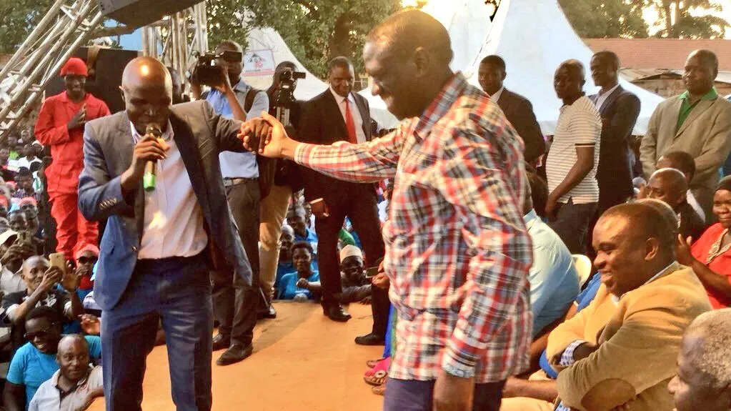 Ronald Mayinja with Dr. Kizza Besigye
